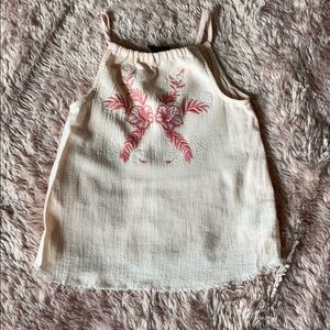 Pink sleeveless top with embroidered flowers